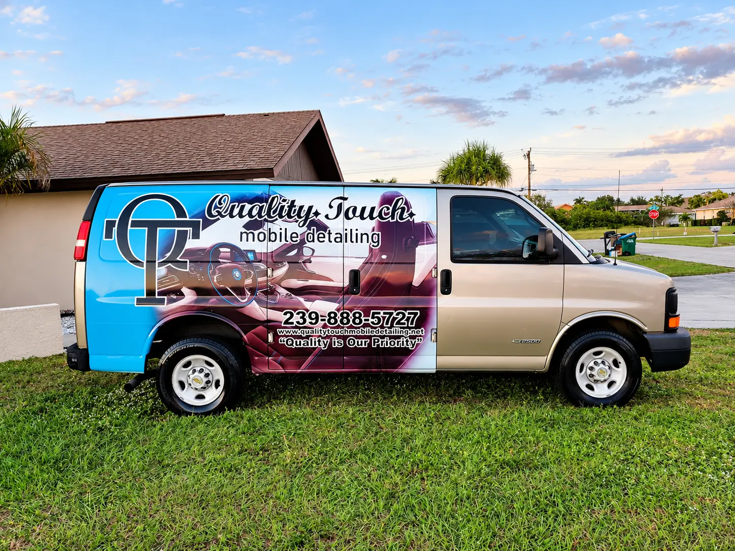 Quality Touch mobile detailing van parked on residential street in Florida